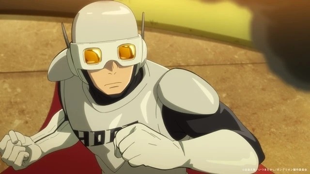 Hopeman, el héroe que representa la justicia en el anime 『Ganglion』, aparece en posición de combate con su traje blanco, casco y capa roja durante el primer episodio.